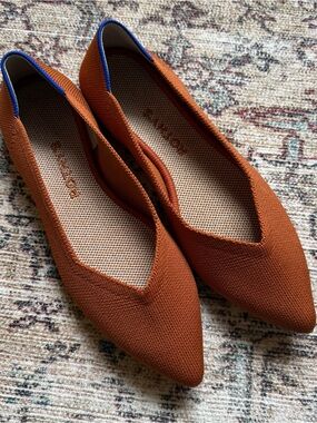 Rothy's Pointed Knit Flats in Rust with Blue Accent